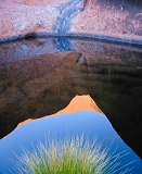 Reflection of rock in pool - Uluru, Australia
