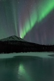 Aurora reflected by frozen Dietrich River - Brooks Range, Alaska