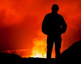 Man looking into Kilauea Volcano - Hawaii Volcanoes National Park