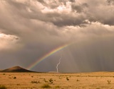 Rainbow, lightning, and anticrepuscular rays - Fort Stockton, Texas