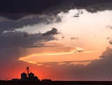 Sunset behind grain bins - Colby, Kansas