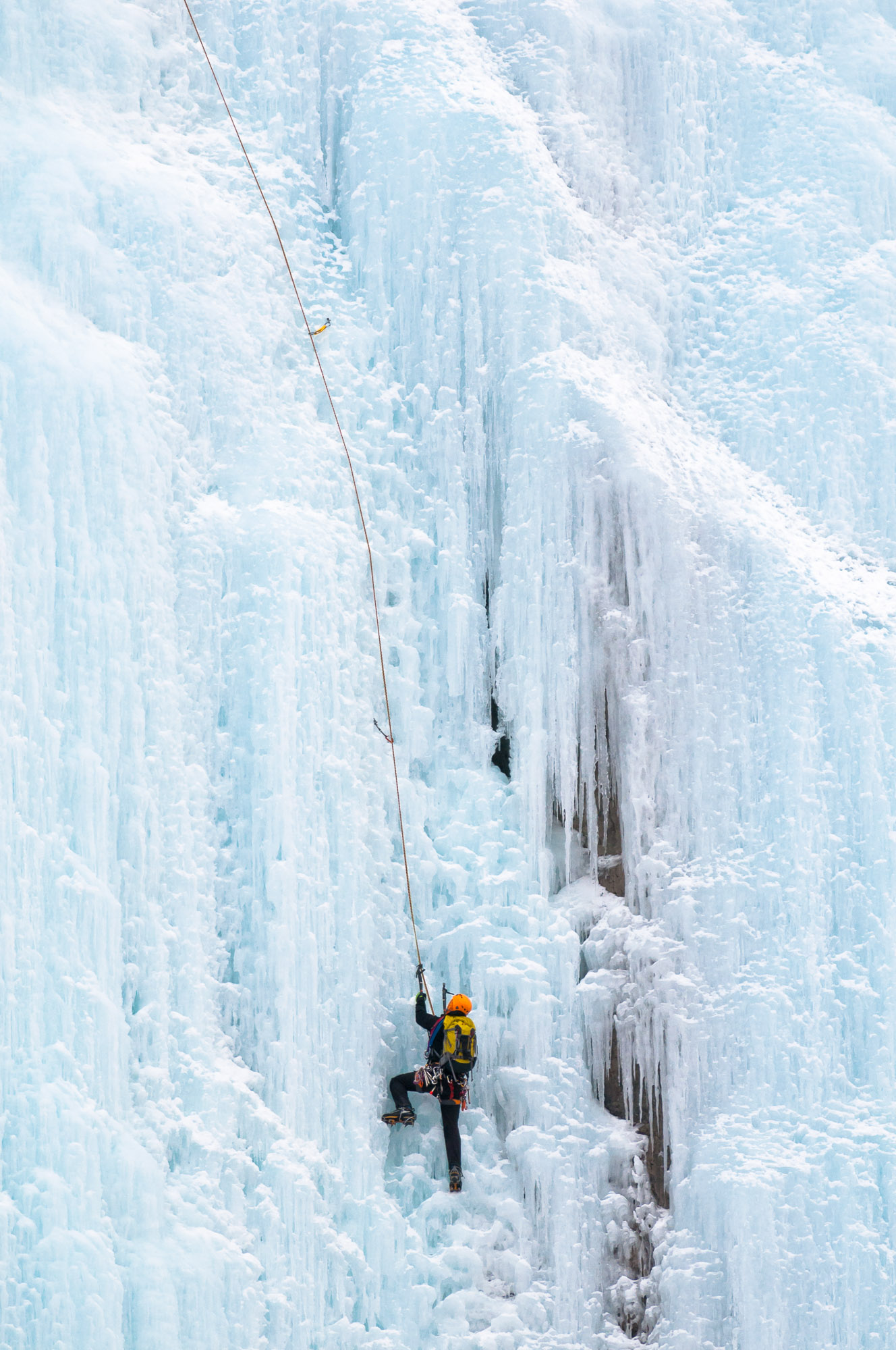 Ice climber on Weeping Wall - Banff National Park, Canada