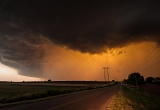 Rain shaft backlit by setting sun - Clinton, Oklahoma