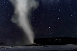 Old Faithful Geyser erupting at night - Yellowstone National Park, Wyoming